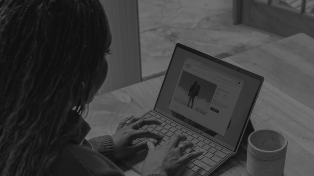 girl blogging on laptop