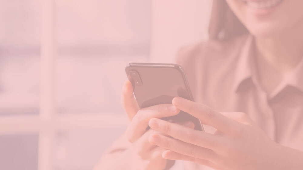 woman typing on smartphone